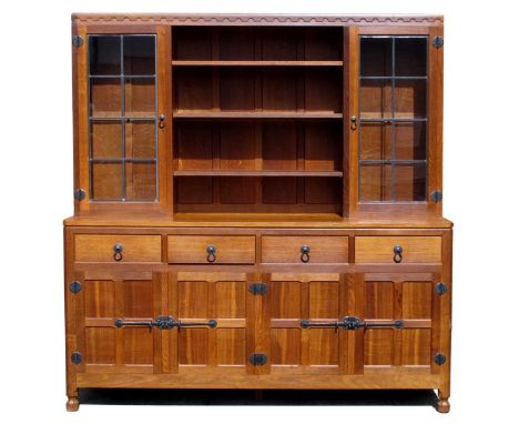 A Robert 'Mouseman' Thompson Oak Display Dresser, the base with four drawers above four cupboards with wrought iron hinges, l