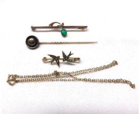 A Mixed Lot comprising: a small yellow metal Bar Brooch, mounted with two Seed Pearl set swallows, 29mm long, stamped “9ct”; 