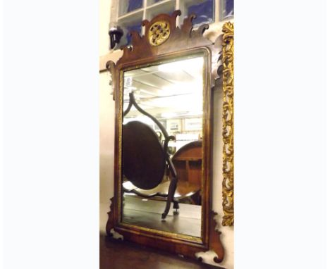 A Walnut Chippendale style parcel gilded large Wall Mirror, the top with central pierced rosette mount, further fret work car