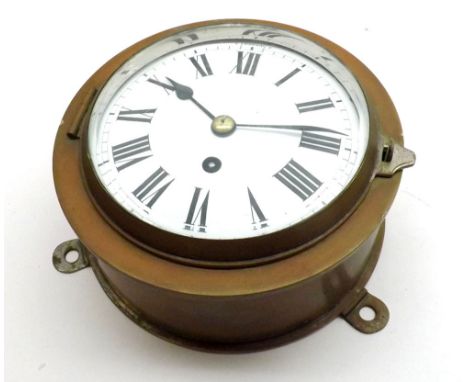 A lacquered Brass cased circular Ships Bulkhead Clock, the circular black Roman chapter ring on a white enamel dial with outs