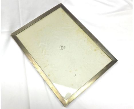 A good George VI Silver Mounted Photograph Frame, rectangular shaped with engine-turned edges, wooden easel back, 12” x 9”, B