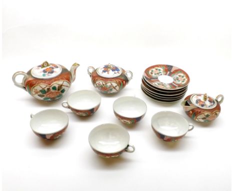 An Imari style 20th Century Tea Service, painted in iron red, underglaze blue and famille verte, with panels of foliage and g