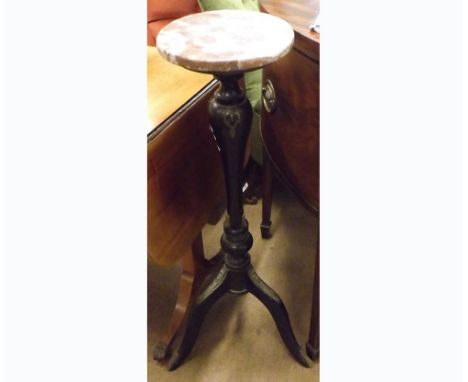 A 19th Century Marble Top Plant Stand, the round top to an ebonised and gilt metal mounted pedestal, raised on a tripod base,