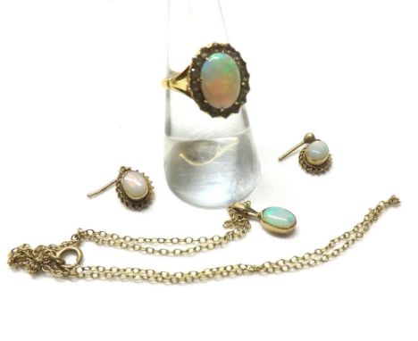 Far Eastern high grade yellow metal Ring featuring a centre Opal surrounded by white stones, together with similar pendant an