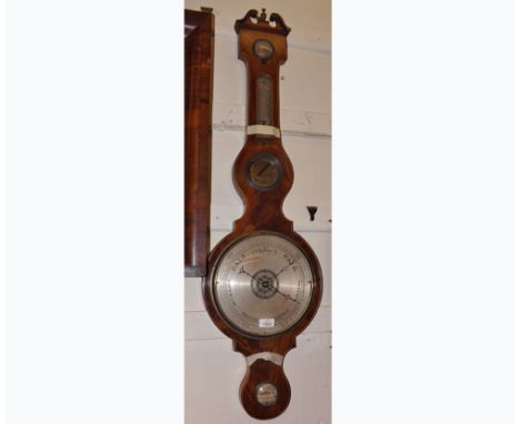 A 19th Century Mahogany cased Wheel Barometer A Taroni LLanelly, dry/damp dial (pointer missing), over central twin scale, re