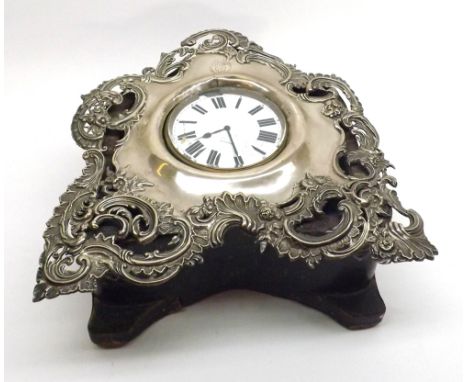An ornate late Victorian Pocket Watch Stand with elaborate pierced Silver foliate front and leather-covered back, hallmarked 