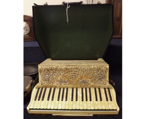 A 1920s/30s Galanti 124 button Piano Accordion, central fabric-covered bellows, detailed Art Deco foliate openwork and diaman