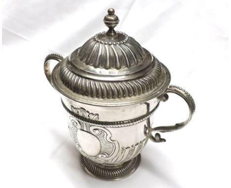 A George II Silver two-handled lidded Loving Cup, the base of tapering cylindrical form with gadrooned foot and raised body b