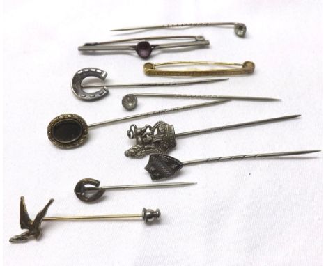 Small mixed lot of eight early 20th Century stick pins with decorative finials and two brooches