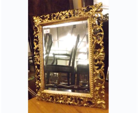 A Giltwood Framed Bevelled Dressing Table Mirror, the frame moulded foliate detail, 17” wide 