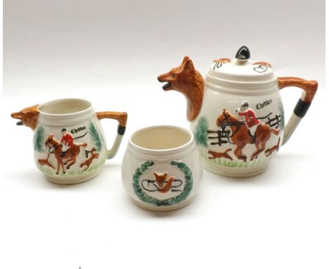 A Novelty Hunting Ware Three Piece Tea Service, the teapot and milk jug with fox mask handles (3) 