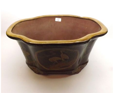 A 20th Century Chinese Large Planter of shaped oval form, decorated with panels of exotic birds and foliage, (foot losses etc