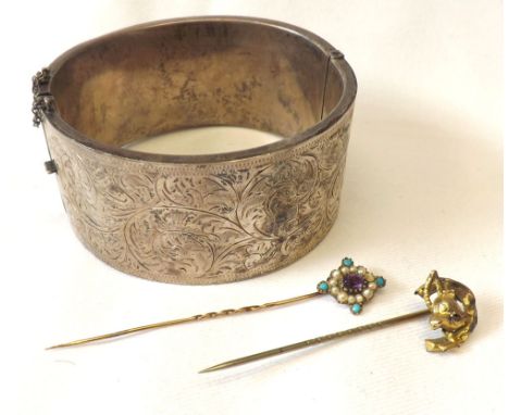 A case containing two Victorian/early 20th Century gold Stick Pins, one with turquoise Seed Pearl and Amethyst finial, the ot