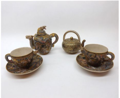 A Satsuma part Tea Service, the small Teapot, handle and spout formed as dragons head and tail respectively, with a similarly