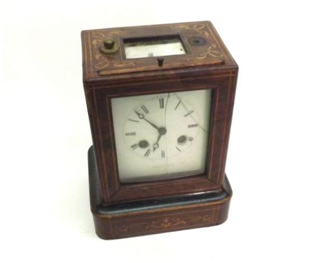 A 19th Century French Travelling Clock in Walnut and Inlaid Case, the brass movement striking on a bell, enamelled face with 