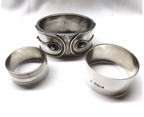 Edwardian hallmarked Silver bangle decorated to the front with two raised tennis rackets with balls attached, floral and foli