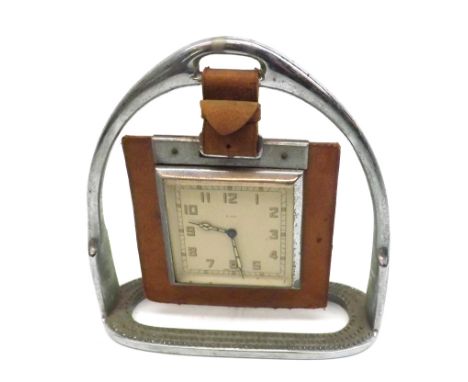 An unusual first half of the 20th Century Smiths 8-Day Bedside Clock, the hanging clock supported in a chrome finish horse’s 