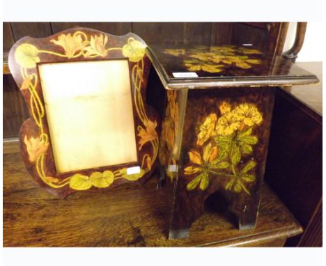 A late 19th/early 20th Century Wall Mirror Frame with floral decoration; together with a similar flip top stool, largest piec