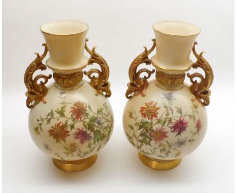 A pair of Royal Worcester Large Two Handled Baluster Vases of conical form applied with foliate scrolled handles, the body is