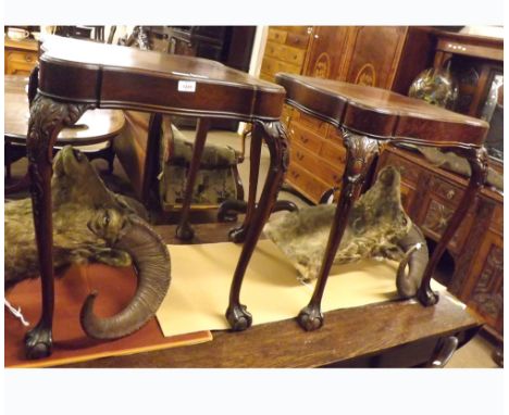 A pair of early 20th Century Mahogany Side Tables, each with gilt tooled Brown Leather tops of shaped square form, the cabrio