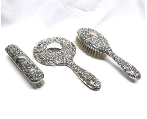 A contemporary 20th Century three piece Dressing Table Set comprising Hand Mirror and two Hand Brushes, all with Birmingham h