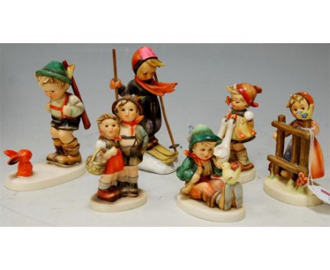 Six various Hummel figures to include skiing boy