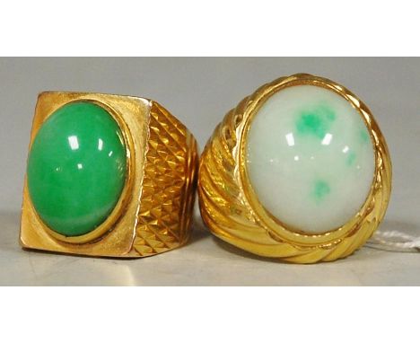 A yellow gold and cabochon jade set ladies dress ring, stamped 750; and one other similar stamped 20k, gross weight 27.8g (2)