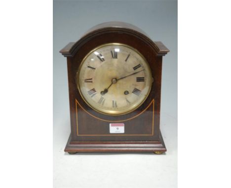 An Edwardian mahogany and boxwood strung mantel clock, having silvered dial and Roman numerals 