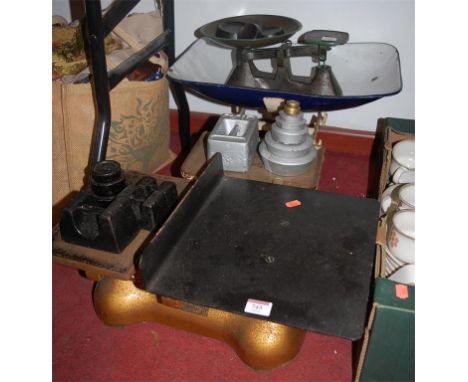 A set of cast iron scales and weights by W & T Avery; together with another set by S J Bell of Aylesbury ** AND ONE OTHER (3)