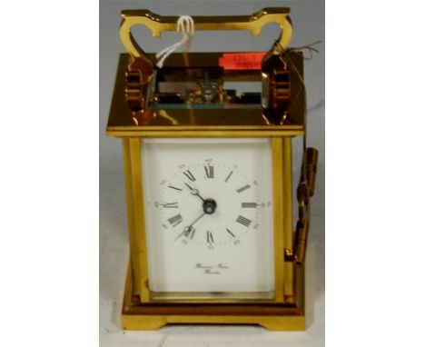 A 20th century lacquered brass cased carriage clock, the white enamel dial with Roman and Arabic numerals, signed Raymond Fre