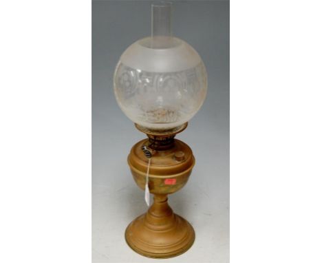 An early 20th century copper oil lamp having etched glass globular shade