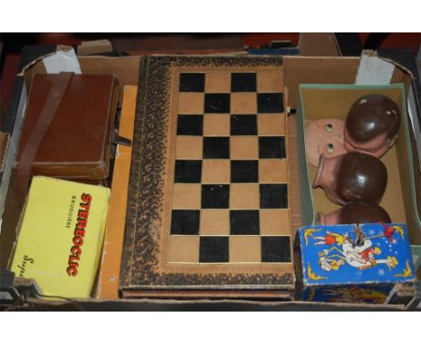 Two boxes of childrens books and games to include; backgammon and chess set, harmonica etc 