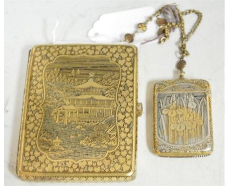 In the manner of Komai - a Japanese Taisho period brass and black lacquered ladies cigarette case/compact, signed; together w