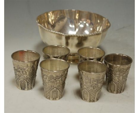 A continental white metal footed bowl and a set of six continental silver plated spirit measures (2)