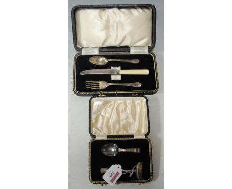 A cased silver two-piece christening set and one other comprising spoon and fork (lacking napkin ring) (2)