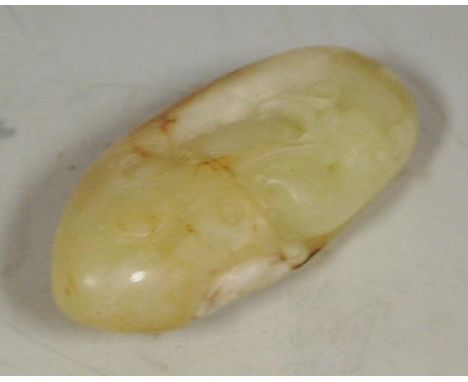A 19th century Chinese carved and polished jade pebble of a Lindsay dragon  Condition Report / Extra Information Russet stria