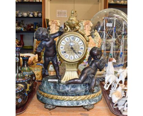 A 19th century style gilt metal, marble striking mantel clock