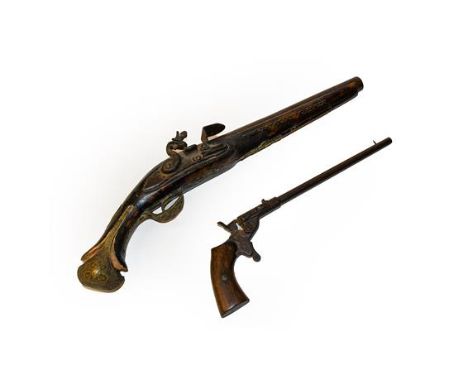 A Continental flintlock pistol and a rimfire target pistol. . Flintlock pistol - action not working. Rust pitting to hammer a