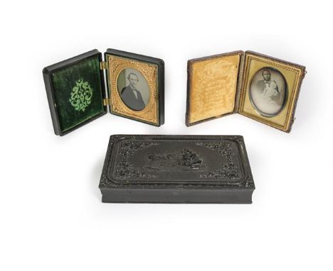 A daguerreotype of a gentleman holding a baby, in fitted leather covered case, stamped 'Whitehurst', the case 9.5cm high; tog