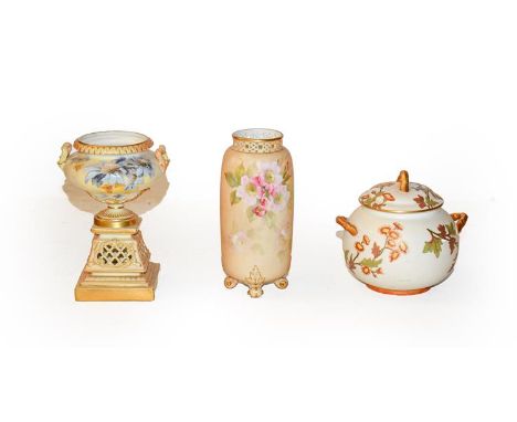 A Royal Worcester blush ivory urn (lacking cover), 14cm, a jar and cover with puce marks (Ovington brothers) 10cm, and a cyli