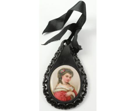 Victorian polished Whitby jet tear-drop shaped pendant with pierced scroll border, hand painted enamel panel and velvet ribbo