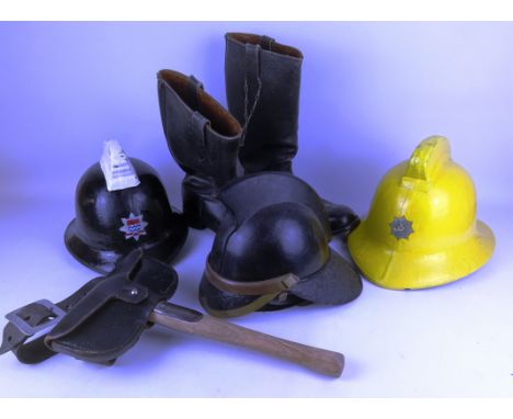 London Fire Brigade fire helmet, Hendry Leather fire helmet, another helmet, a pair of firemans boots and an axe on leather b