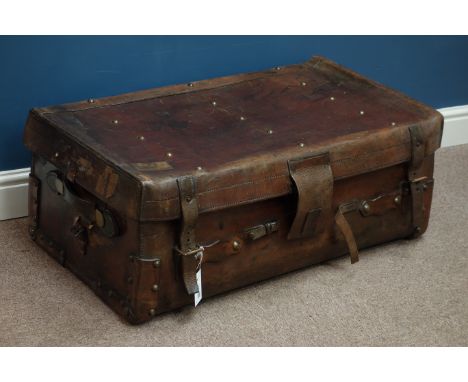 Early 20th century leather travelling trunk with brass studded top and NER label, W83cm   Condition Report   Click here for f
