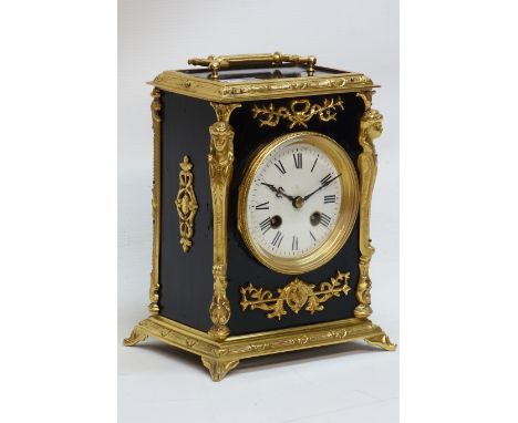 Early 20th century French gilt metal ebonised mantel clock, twin train movement striking the half hours on a bell, H27cm CLOC