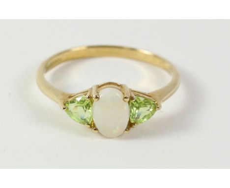 9ct peridot and opal ring hallmarked   Condition Report   Click here for further images, condition, auction times & delivery 