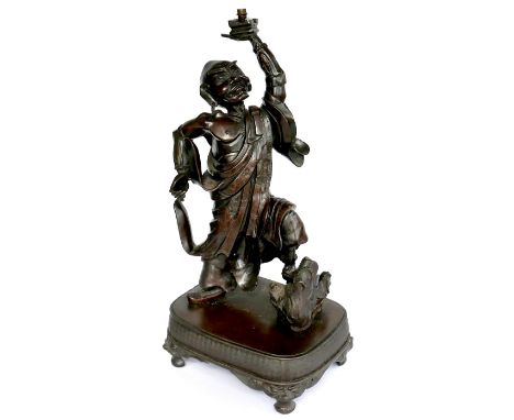 A late 19th century Japanese bronze sculpture, modelled as a man holding his left arm aloft, 48cm high. 