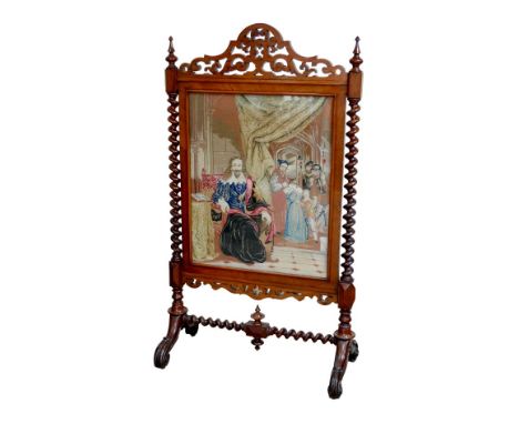 A Victorian mahogany firescreen, with a tapestry of King Charles I under arrest, bearing a 20th century hand written label ve