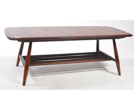 Ercol - A mid century 1960s Ercol elm Windsor pattern 45A coffee table in golden dawn colour, with open spindle undershelf.35