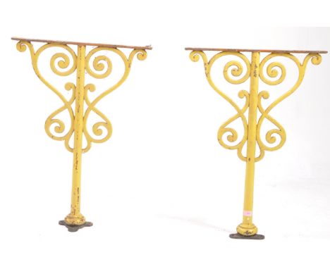 A pair of 19th century Victorian cast and wrought iron architectural wall / table bases brackets / columns. Yellow painted pi