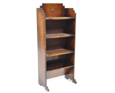 An early 20th century 1930s Art Deco pedestal oak wood bookshelf &amp; book trough. The bookshelf having stepped gallery surr
